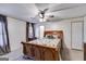 Inviting main bedroom with a decorative bed frame, a ceiling fan, and natural light creating a relaxing atmosphere at 333/337 Old Carrollton Rd, Roopville, GA 30170