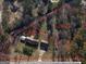 Aerial view of the property showcasing the house, outbuildings, and the approximate 1.80 acre lot boundaries at 8380 Cedar Grove & 8400 Teal Road Rd, Fairburn, GA 30213