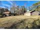 Spacious backyard with shed and home, offering ample room for outdoor activities and relaxation at 8380 Cedar Grove & 8400 Teal Road Rd, Fairburn, GA 30213