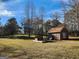 Lush backyard featuring a shed and a small platform, providing a serene and inviting outdoor space at 8380 Cedar Grove & 8400 Teal Road Rd, Fairburn, GA 30213