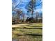 Spacious grassy yard surrounded by mature trees, creating a serene and natural setting at 8380 Cedar Grove & 8400 Teal Road Rd, Fairburn, GA 30213