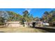 Home exterior and screened porch overlooking a sprawling backyard with lush greenery and mature trees at 8380 Cedar Grove & 8400 Teal Road Rd, Fairburn, GA 30213