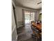 The dining area features wood-look floors, a patio door to a sunroom, and stylish accents at 8380 Cedar Grove & 8400 Teal Road Rd, Fairburn, GA 30213