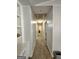 Hallway with neutral colors and ample overhead lighting leading to other rooms at 8380 Cedar Grove & 8400 Teal Road Rd, Fairburn, GA 30213