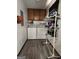Functional laundry room with washer, dryer, and overhead cabinets for ample storage at 8380 Cedar Grove & 8400 Teal Road Rd, Fairburn, GA 30213