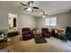 Spacious living room featuring ceiling fans and comfortable seating arrangement at 8380 Cedar Grove & 8400 Teal Road Rd, Fairburn, GA 30213