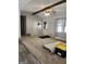 Bright living room features a front door, beams on the ceiling, and a window at 8380 Cedar Grove & 8400 Teal Road Rd, Fairburn, GA 30213