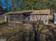 An exterior shot of the large back deck, screened in porch, and rear of the home at 8380 Cedar Grove & 8400 Teal Road Rd, Fairburn, GA 30213