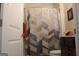 Cozy bathroom highlighting a vanity, geometric shower curtain, and neutral wall color at 2297 Knob Creek Dr, Snellville, GA 30078