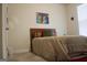 Inviting bedroom showcasing a wood headboard bed, decorative pillows, and a bright colorful painting at 2297 Knob Creek Dr, Snellville, GA 30078