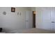 Neutral bedroom featuring light walls, carpet and a doorway with an open door and a closed door at 2297 Knob Creek Dr, Snellville, GA 30078