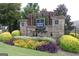 Saddle Brook community entrance sign surrounded by colorful landscaping and manicured greenery at 2297 Knob Creek Dr, Snellville, GA 30078