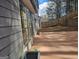 Exterior view of a home with a concrete patio and fenced-in yard at 6558 Eastbriar Dr, Lithonia, GA 30058