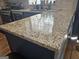 Kitchen features granite countertops, stainless steel appliances, and ample storage for a modern culinary experience at 6558 Eastbriar Dr, Lithonia, GA 30058