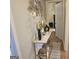 Inviting hallway decorated with modern art and a stylish console table at 6558 Eastbriar Dr, Lithonia, GA 30058