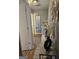Hallway featuring a console table with decorative vase, leading to other rooms at 6558 Eastbriar Dr, Lithonia, GA 30058