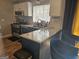 Well-equipped kitchen boasts granite countertops, modern appliances, and ample space, perfect for culinary endeavors at 6558 Eastbriar Dr, Lithonia, GA 30058
