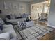 Cozy living room with modern decor, neutral-toned sofas, and stylish accents at 6558 Eastbriar Dr, Lithonia, GA 30058