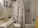 Cozy bathroom featuring subway tile, Paris-themed shower curtain, and granite vanity at 6558 Eastbriar Dr, Lithonia, GA 30058