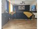 Cozy living room with dark accent wall and contemporary furniture, great for relaxation and entertainment at 6558 Eastbriar Dr, Lithonia, GA 30058