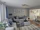 Comfortable living room with neutral color scheme and view into the dining room at 6558 Eastbriar Dr, Lithonia, GA 30058