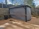 Covered gazebo in a backyard featuring a concrete patio and privacy fence at 6558 Eastbriar Dr, Lithonia, GA 30058