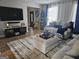 Spacious living room with contemporary furnishings, stylish decor, and ample natural light at 6558 Eastbriar Dr, Lithonia, GA 30058