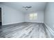 Bedroom showcasing hardwood floors, a ceiling fan, and a bright window at 225 Mertis Ln, Carrollton, GA 30116