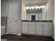 Bathroom featuring a double sink vanity with granite countertop at 140 Tye St, Stockbridge, GA 30281