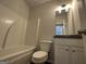Bathroom featuring a shower-tub combo and vanity at 140 Tye St, Stockbridge, GA 30281