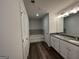 Bathroom showcasing a double sink vanity, shower, and tub at 140 Tye St, Stockbridge, GA 30281