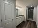 Bathroom featuring a double sink vanity and glass shower at 140 Tye St, Stockbridge, GA 30281