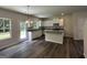 Well-lit kitchen with an island, and stainless steel appliances at 140 Tye St, Stockbridge, GA 30281