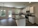 Kitchen featuring an island, stainless steel appliances, and granite counters at 140 Tye St, Stockbridge, GA 30281