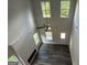 Bright living room with a fireplace and views from the high ceiling at 140 Tye St, Stockbridge, GA 30281