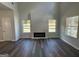Spacious living room with dark flooring and plenty of natural light at 140 Tye St, Stockbridge, GA 30281