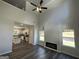 Living room boasting high ceilings, a fireplace, and dark laminate flooring at 140 Tye St, Stockbridge, GA 30281