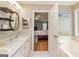 Bathroom with double vanity, garden tub and connecting door to the main bedroom at 270 Sturgess Run, Sharpsburg, GA 30277
