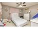 Bedroom features a full bed, ceiling fan, and pink decor at 270 Sturgess Run, Sharpsburg, GA 30277