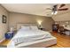 Bedroom featuring a queen bed, ceiling fan, and hardwood floors at 270 Sturgess Run, Sharpsburg, GA 30277