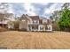 Charming two-story home with stone accents, inviting front porch, and well-maintained lawn at 270 Sturgess Run, Sharpsburg, GA 30277