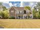 Charming two-story home with stone accents, inviting front porch, and well-maintained lawn at 270 Sturgess Run, Sharpsburg, GA 30277