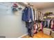 Spacious walk-in closet with ample hanging space, shelving and wooden floors at 270 Sturgess Run, Sharpsburg, GA 30277