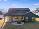 Aerial view of the home showcasing a spacious backyard, covered patio, and outdoor kitchen area at 859 N Bay Overlook, Villa Rica, GA 30180