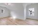 Bright bedroom with vaulted ceilings, two windows allowing ample natural light and wood look flooring at 859 N Bay Overlook, Villa Rica, GA 30180