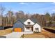 Beautiful home with a modern garage door, appealing brickwork, and a large front yard at 859 N Bay Overlook, Villa Rica, GA 30180