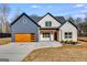 Stunning two-story home with a modern garage door, and an attractive landscaped yard at 859 N Bay Overlook, Villa Rica, GA 30180