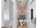 Hallway featuring decorative light fixture, neutral paint and wood look flooring at 859 N Bay Overlook, Villa Rica, GA 30180