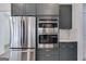 Modern kitchen appliances including a stainless steel refrigerator, microwave, and oven at 859 N Bay Overlook, Villa Rica, GA 30180