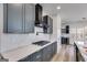 Stylish kitchen with white countertops, gray cabinets, and a modern black range hood at 859 N Bay Overlook, Villa Rica, GA 30180